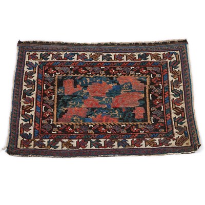 Lot 957 - A SMALL PERSIAN RUG