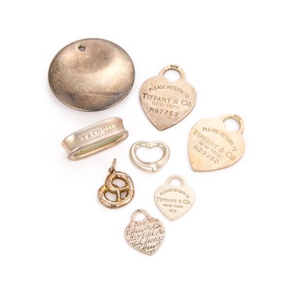 Lot 726 - TIFFANY & CO - A COLLECTION OF SILVER PENDANTS, TAGS AND CHARMS