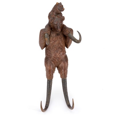 Lot 1086 - A BLACK FOREST CARVED WOOD NOVELTY BEAR-FORM HOOK