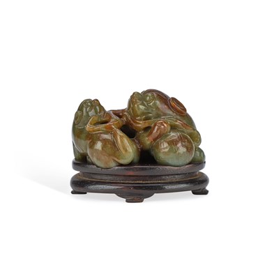 Lot 541 - A CHINESE JADE CARVING OF A BUDDHIST LION AND PUPPY