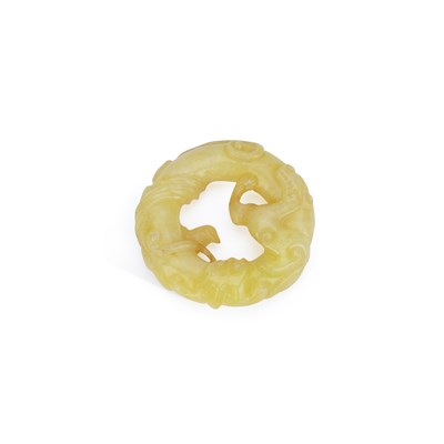 Lot 525 - A CHINESE YELLOW JADE ‘CHILONG’ DISC