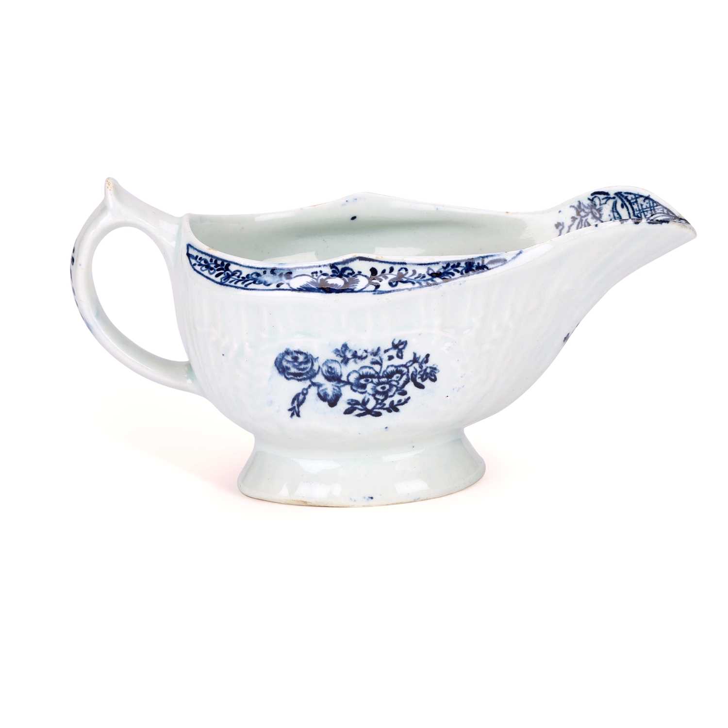 Lot 126 - A LOWESTOFT PORCELAIN SAUCEBOAT