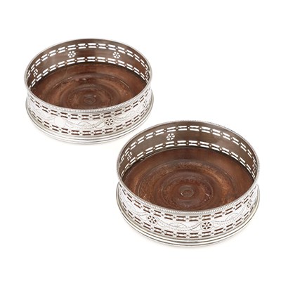 Lot 658 - A PAIR OF GEORGE III SILVER WINE COASTERS