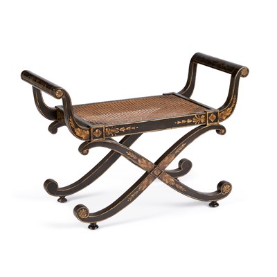 Lot 1240 - A REGENCY STYLE PARCEL-GILT X-FORM WINDOW SEAT
