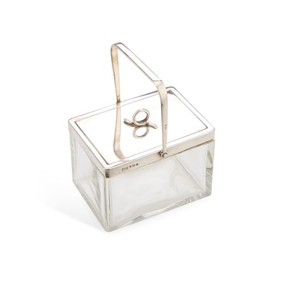 Lot 556 - A GEORGE V SILVER-MOUNTED RECTANGULAR GLASS BISCUIT BOX AND COVER