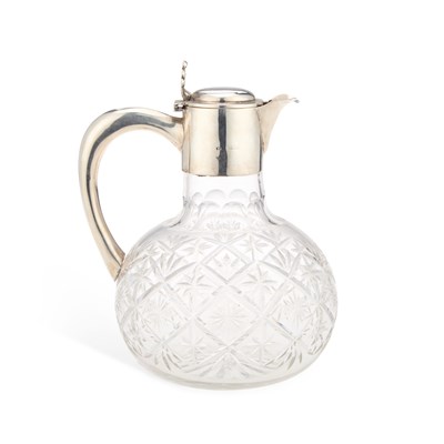 Lot 509 - AN EDWARDIAN SILVER-MOUNTED CUT-GLASS CLARET JUG