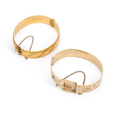 Lot 917 - TWO ROLLED GOLD HINGED BANGLES