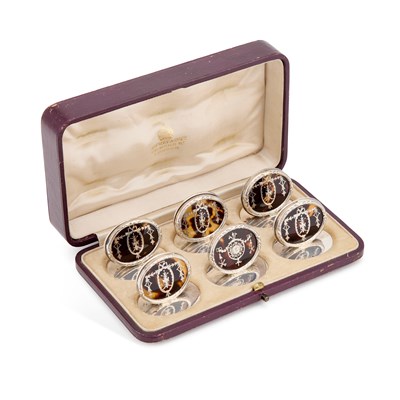 Lot 369 - A MATCHED SET OF SIX GEORGE V SILVER AND TORTOISESHELL MENU HOLDERS
