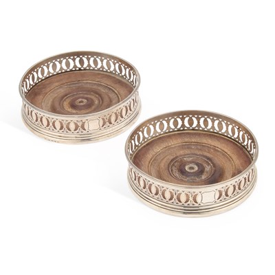 Lot 431 - A PAIR OF GEORGE III SILVER BOTTLE COASTERS