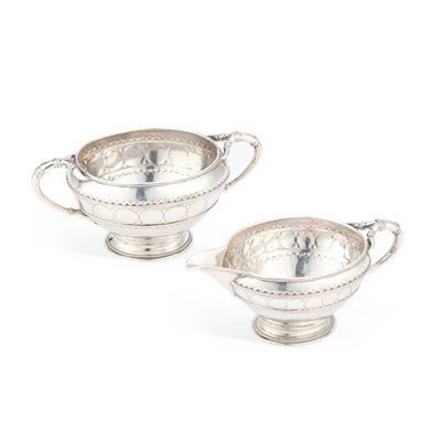 Lot 336 - AN ARTS AND CRAFTS SILVER CREAM JUG AND SUGAR BOWL