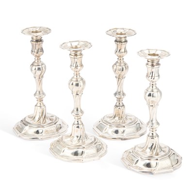 Lot 450 - A SET OF FOUR GEORGE II CAST SILVER CANDLESTICKS
