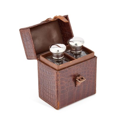 Lot 351 - A PAIR OF GEORGE V SILVER-TOPPED COLOGNE BOTTLES
