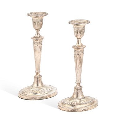 Lot 394 - A PAIR OF EDWARDIAN SILVER CANDLESTICKS