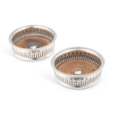 Lot 444 - A PAIR OF GEORGE III SILVER WINE COASTERS