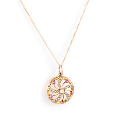 Lot 782 - AN EDWARDIAN 9 CARAT GOLD RUBY AND SEED PEARL PENDANT ON CHAIN