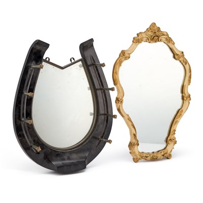 Lot 1081 - A HORSESHOE SHAPED MIRROR