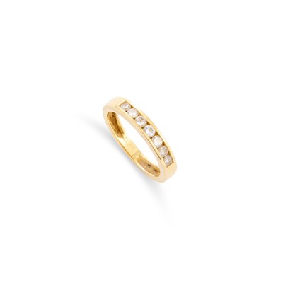 Lot 747 - AN 18 CARAT GOLD DIAMOND BAND RING