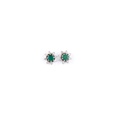 Lot 678 - A PAIR OF 18 CARAT WHITE GOLD EMERALD AND DIAMOND CLUSTER EARRINGS