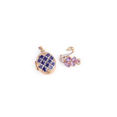 Lot 662 - A GEM-SET BROOCH AND AN ENAMEL OVAL LOCKET PENDANT