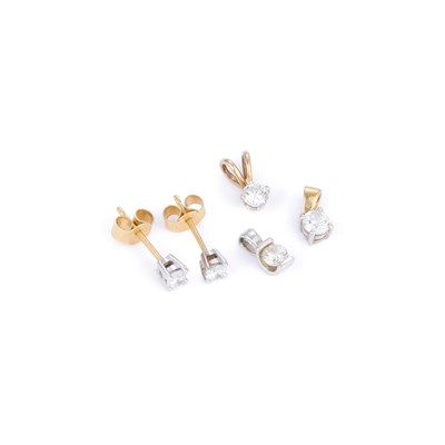 Lot 673 - A PAIR OF 18 CARAT GOLD SOLITAIRE DIAMOND EARRINGS AND THREE 9 CARAT GOLD SOLITAIRE DIAMOND PENDANTS
