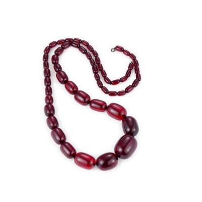 Lot 796 - A PRYSTAL CHERRY AMBER BAKELITE BEAD NECKLACE