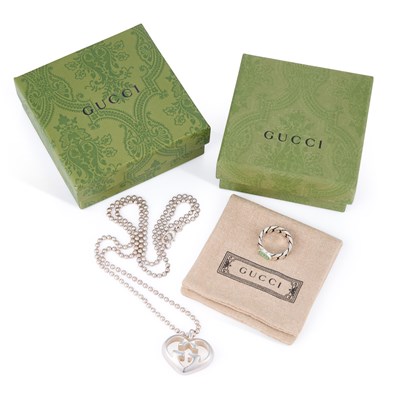 Lot 639 - A GUCCI 'LOVE BRITT' HEART PENDANT NECKLACE AND A GUCCI RING
