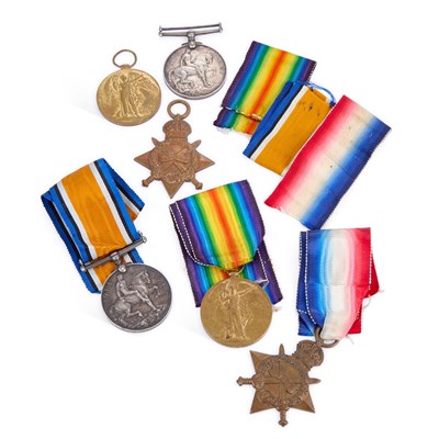 Lot 33 - TWO FIRST WORLD WAR MEDAL TRIOS