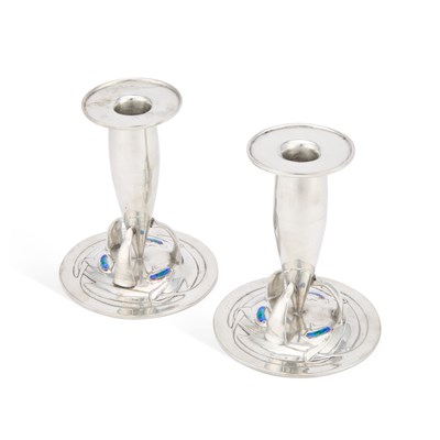 Lot 243 - ARCHIBALD KNOX (1864-1933) FOR LIBERTY & CO, A PAIR OF TUDRIC PEWTER AND ENAMEL CANDLESTICKS