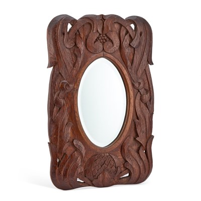 Lot 1080 - AN ARTS AND CRAFTS CARVED OAK MIRROR