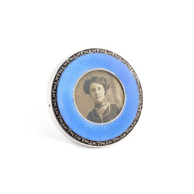 Lot 345 - A GEORGE V SILVER AND ENAMEL PHOTOGRAPH FRAME
