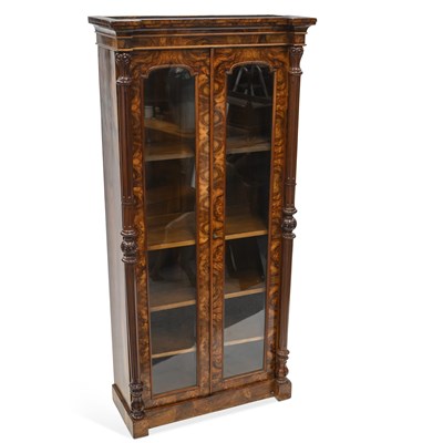 Lot 1128 - A 19TH CENTURY CONTINENTAL WALNUT TWO-DOOR BOOKCASE