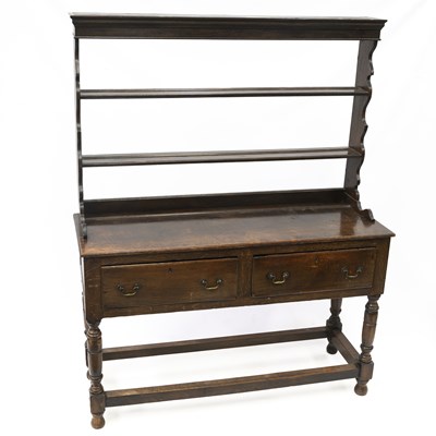 Lot 1114 - A GEORGE III OAK DRESSER AND RACK