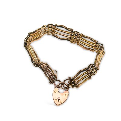 Lot 764 - A 9 CARAT GOLD GATE LINK BRACELET WITH A HEART PADLOCK CLASP