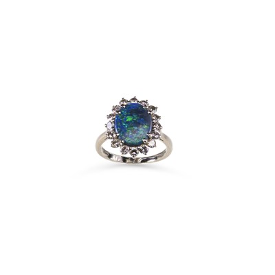 Lot 733 - AN 18 CARAT WHITE GOLD BLACK OPAL AND DIAMOND CLUSTER RING