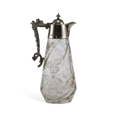 Lot 328 - AN EDWARDIAN SILVER-MOUNTED CUT-GLASS CLARET JUG