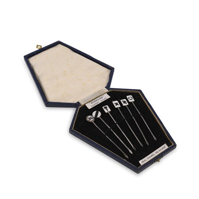 Lot 315 - A GEORGE V CASED SET OF NOVELTY SILVER AND ENAMEL 'RODESINE' COCKTAIL STICKS