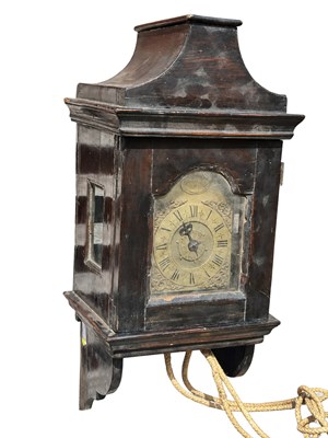 Lot 856 - A GEORGE III EBONISED HOODED WALL CLOCK WITH ALARM
