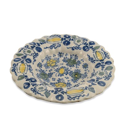 Lot 128 - A DUTCH DELFT POLYCHROME CHARGER