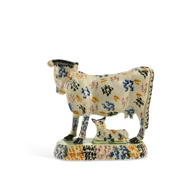 Lot 75 - A YORKSHIRE PRATTWARE COW GROUP