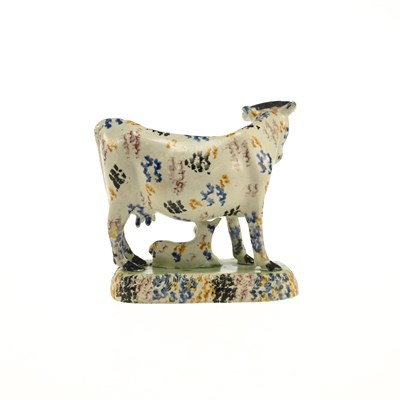 Lot 75 - A YORKSHIRE PRATTWARE COW GROUP