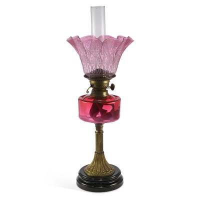 Lot 1014 - A VICTORIAN CRANBERRY GLASS AND BRASS OIL LAMP