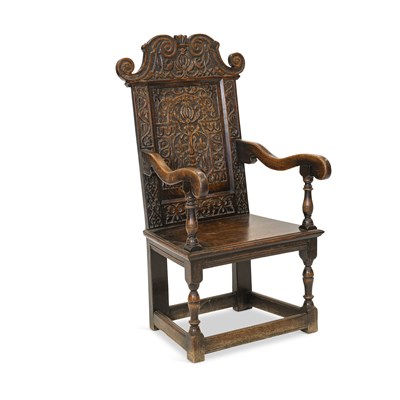 Lot 1125 - A 17TH CENTURY STYLE CARVED OAK WAINSCOT CHAIR