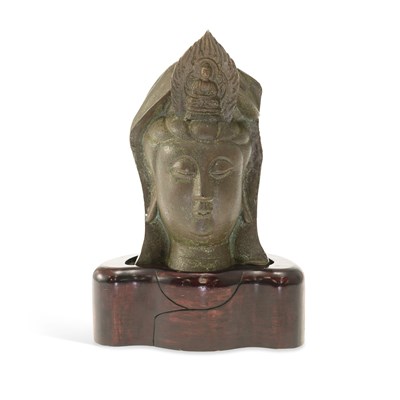 Lot 538 - A CHINESE PATINATED BRONZE HEAD OF GUANYIN