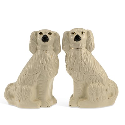 Lot 84 - A PAIR OF STAFFORDSHIRE POTTERY SPANIELS