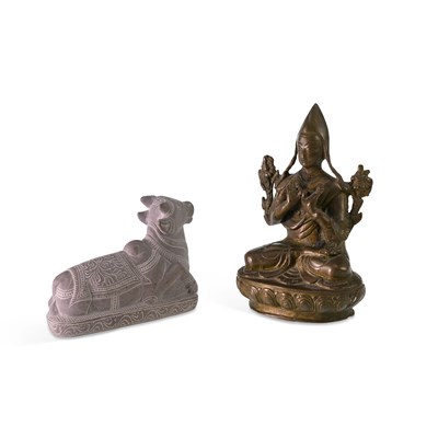 Lot 532 - A TIBETAN BRONZE FIGURE OF TSONGKHAPA AND AN INDIAN CARVED STONE MODEL OF NANDI