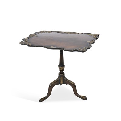 Lot 1062 - A 19TH CENTURY PARCEL-GILT AND CARVED MAHOGANY TILT-TOP TRIPOD TABLE