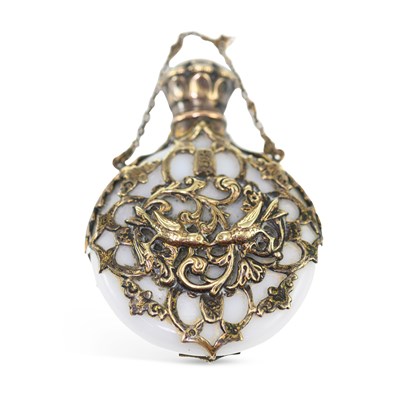 Lot 810 - A 19TH CENTURY SILVER-GILT MOUNTED OPALINE GLASS SCENT BOTTLE