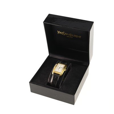 Lot 577 - A LADY'S GOLD PLATED YVES SAINT LAURENT STRAP WATCH