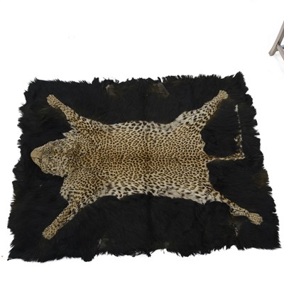 Lot 1000 - AN EARLY 20TH CENTURY LEOPARD SKIN RUG/ CARRIAGE BLANKET
