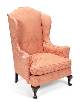 Lot 892 - A WING-BACK ARMCHAIR